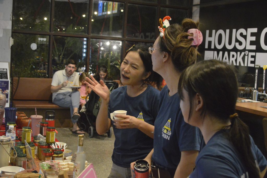 People interacting in a cafe setting.